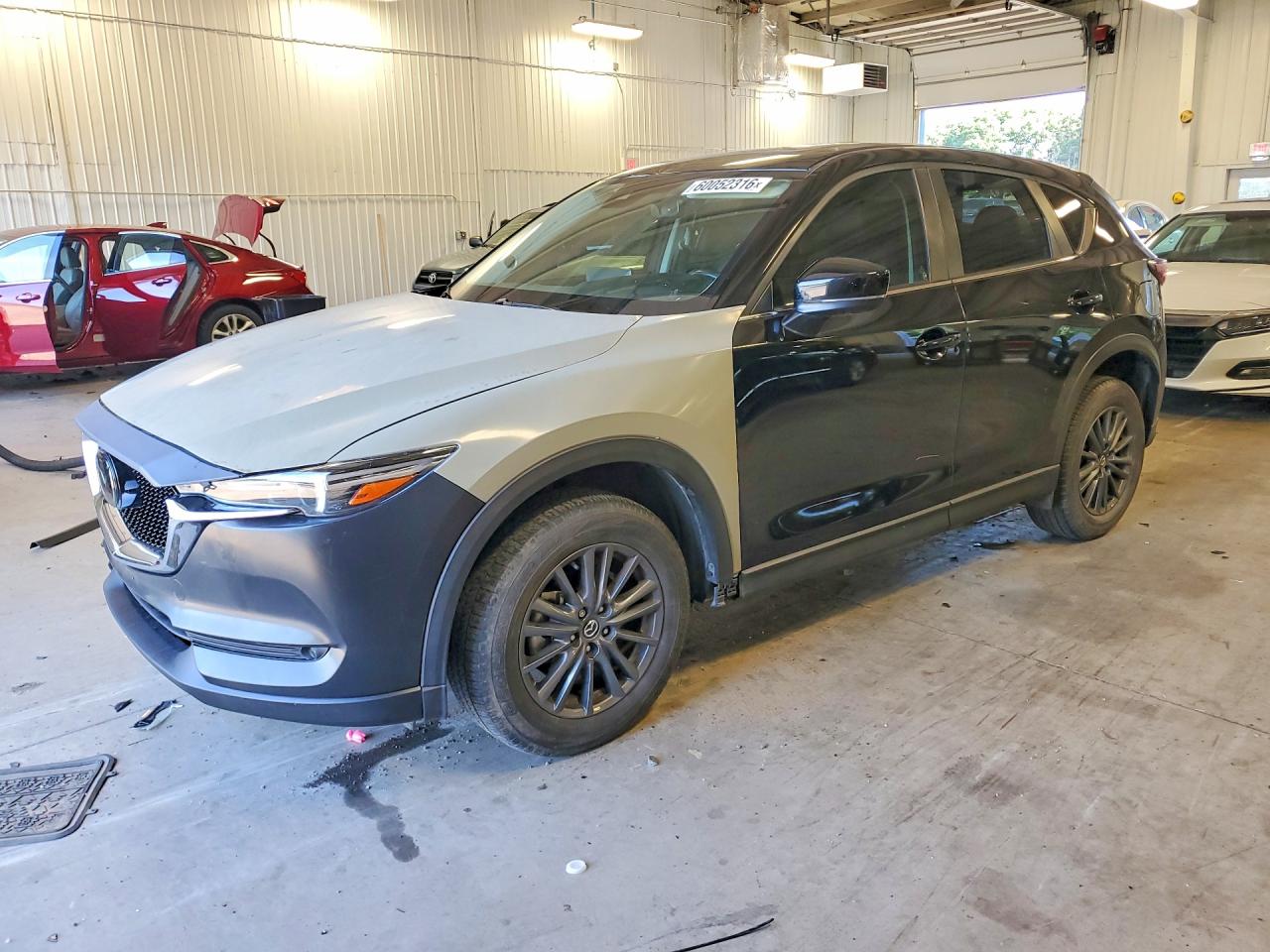 2021 Mazda CX-5 Touring, VIN JM3KFACMXM1394822 — Side