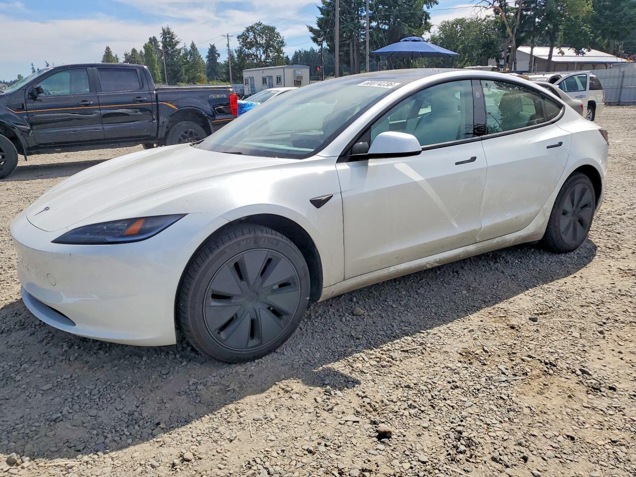 2026 Tesla Model 3 Premium, VIN 5YJ3E1EBXTF121221 — Side