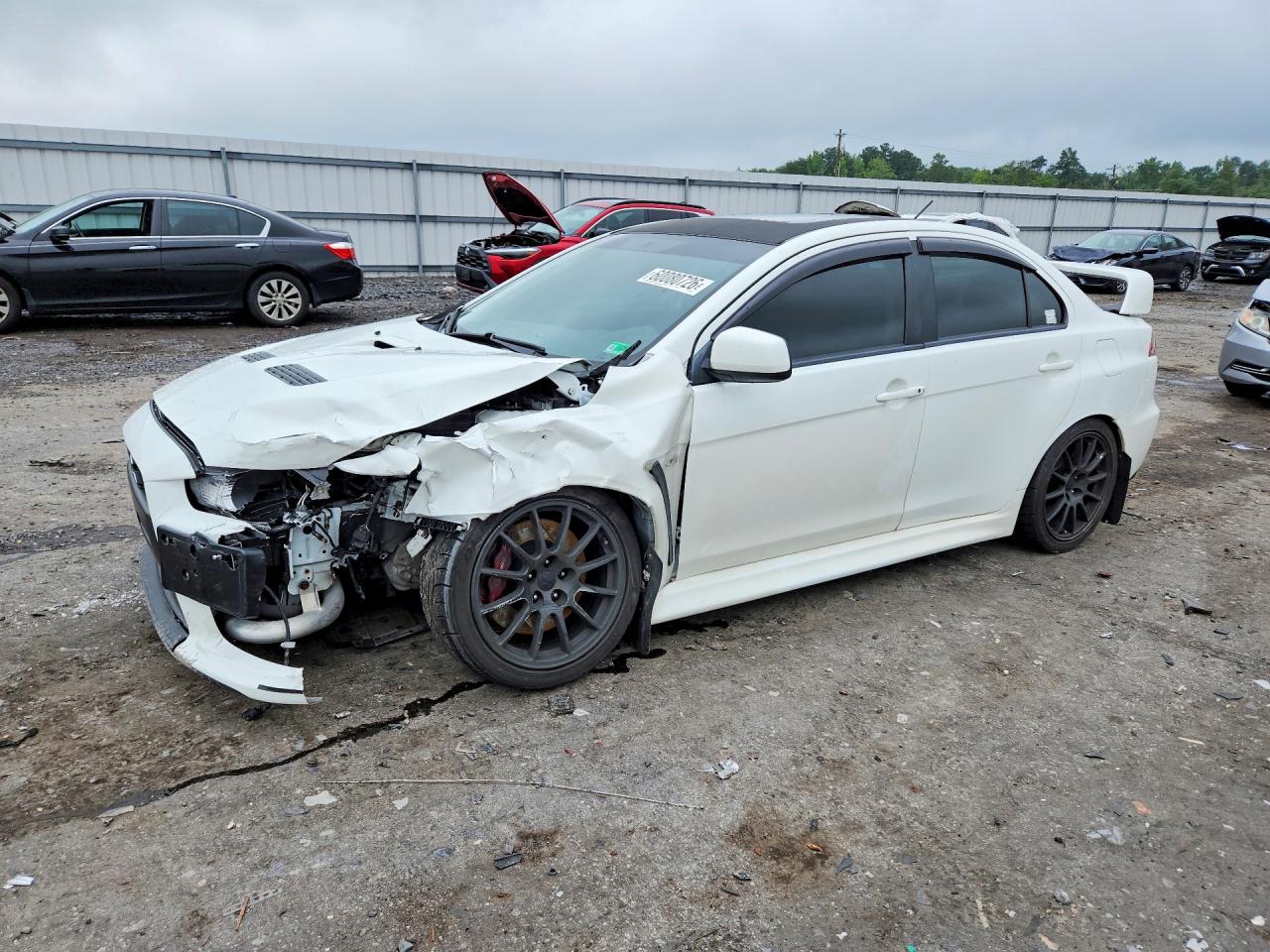 2011 Mitsubishi Lancer Evolution GSR, VIN JA32W8FV3BU046909 — Front end