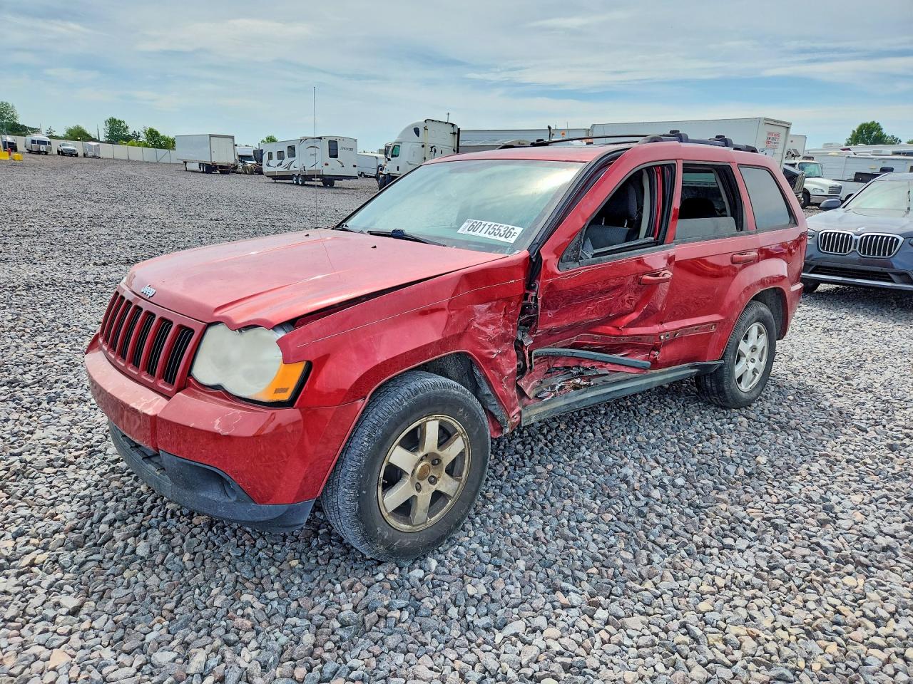 2009 Jeep Grand Cherokee Laredo, VIN 1J8GR48K59C550185 — Side