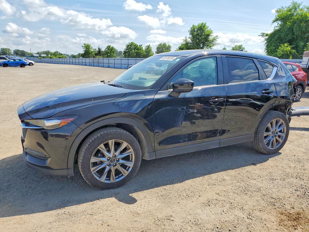 2021 Mazda CX-5 Touring, VIN JM3KFBCM7M1424249 — Rear end
