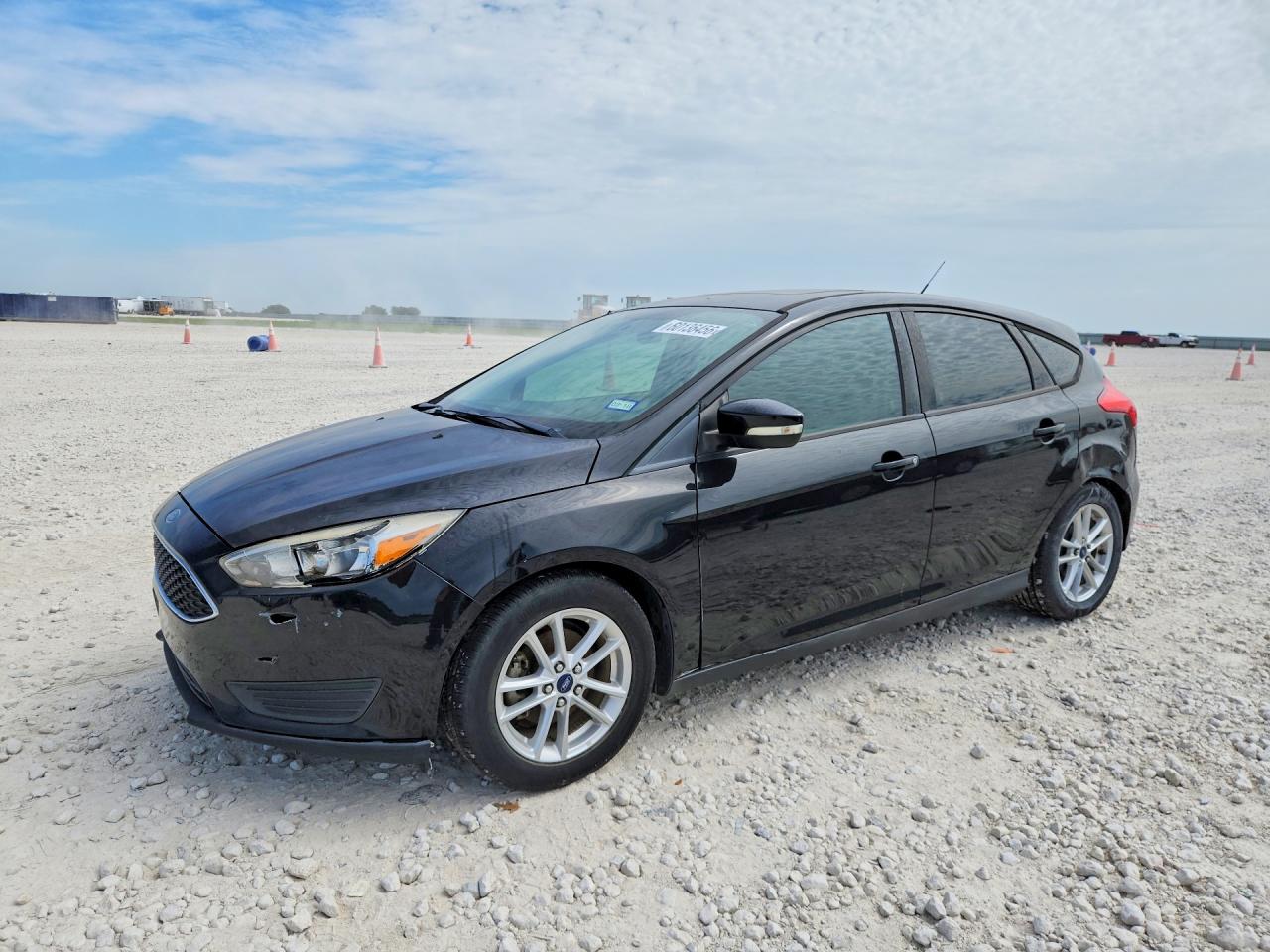 2016 Ford Focus SE, VIN 1FADP3K24GL216803 — Hail