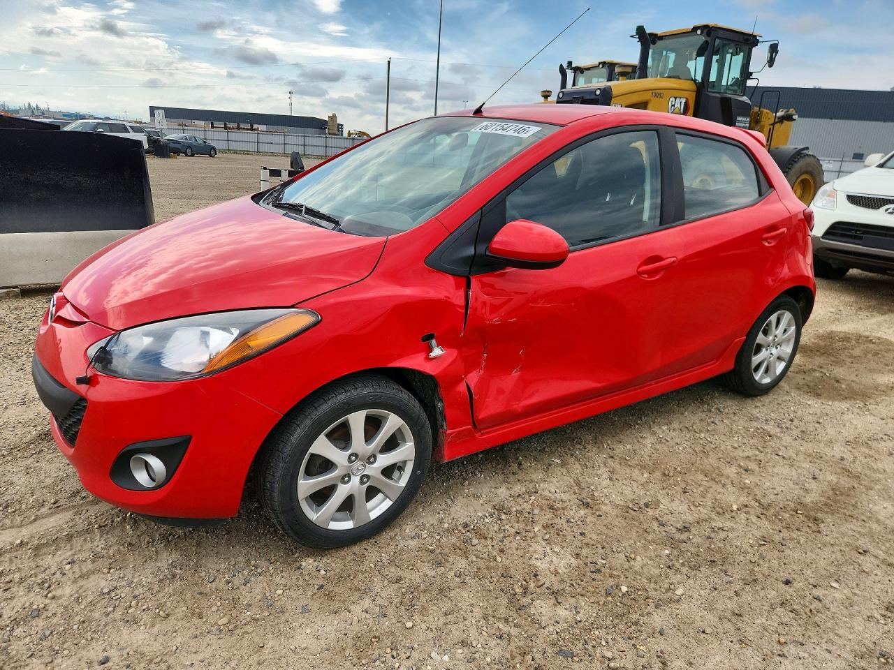 2011 Mazda 2 Touring, VIN JM1DE1HY4B0113102 — Side
