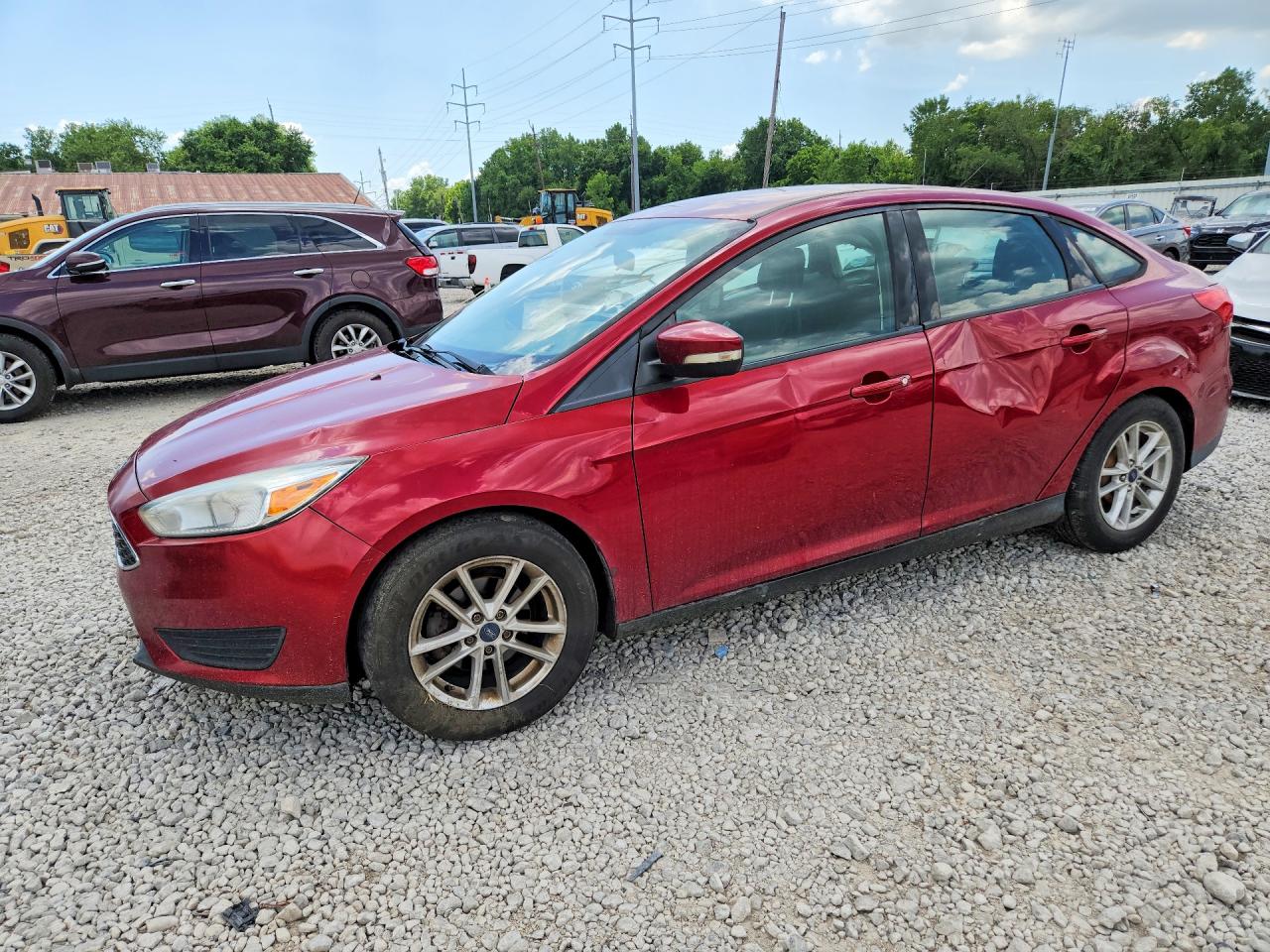 2016 Ford Focus SE, VIN 1FADP3F25GL376456 — Side