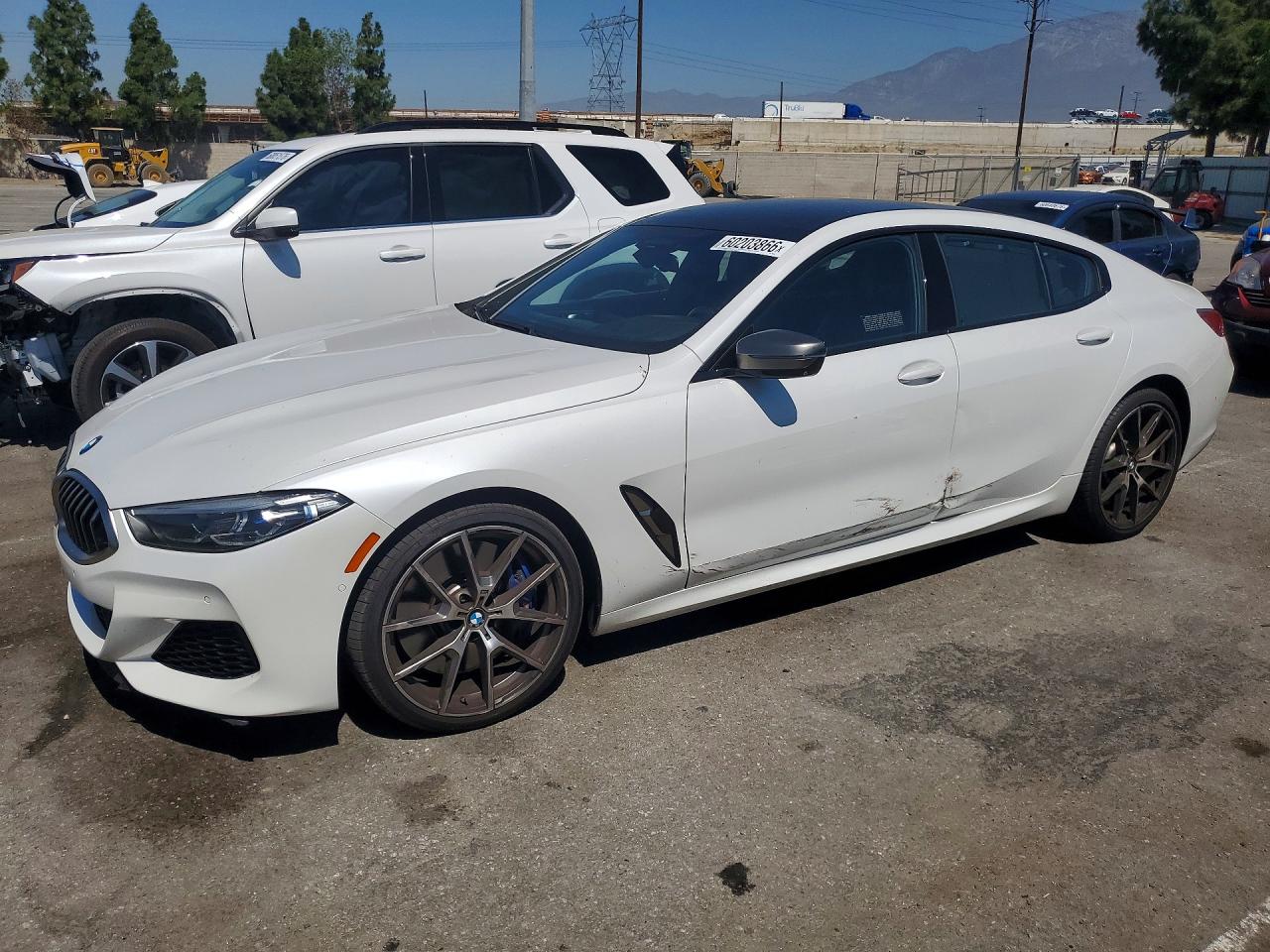 2020 BMW 8 Series M850i, VIN WBAGV8C0XLBP48612 — Side