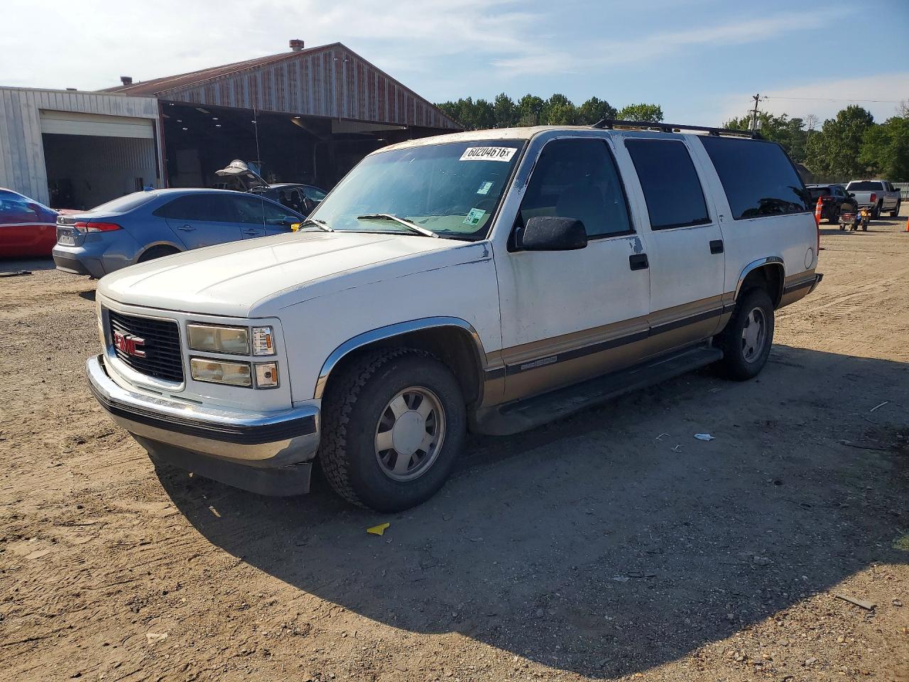 1999 GMC Suburban, VIN 1GKEC16R5XJ751208 — Minor dents and scratches