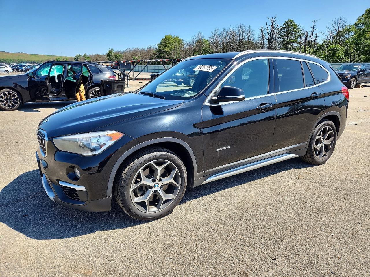 2018 BMW X1 xDrive28i, VIN WBXHT3C37J5F89916 — Rear end