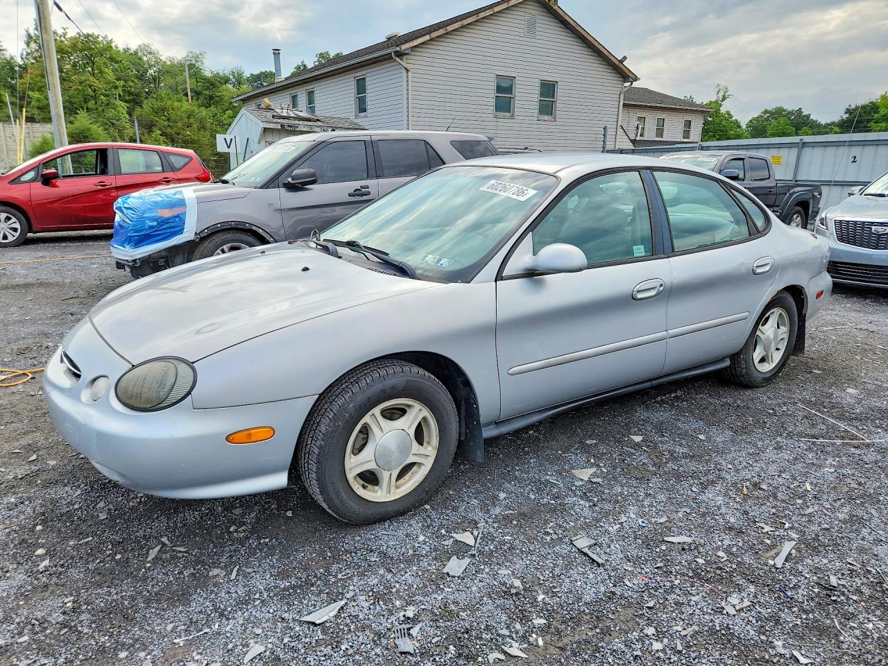1999 Ford Taurus SE, VIN 1FAFP53U8XA248945 — Side