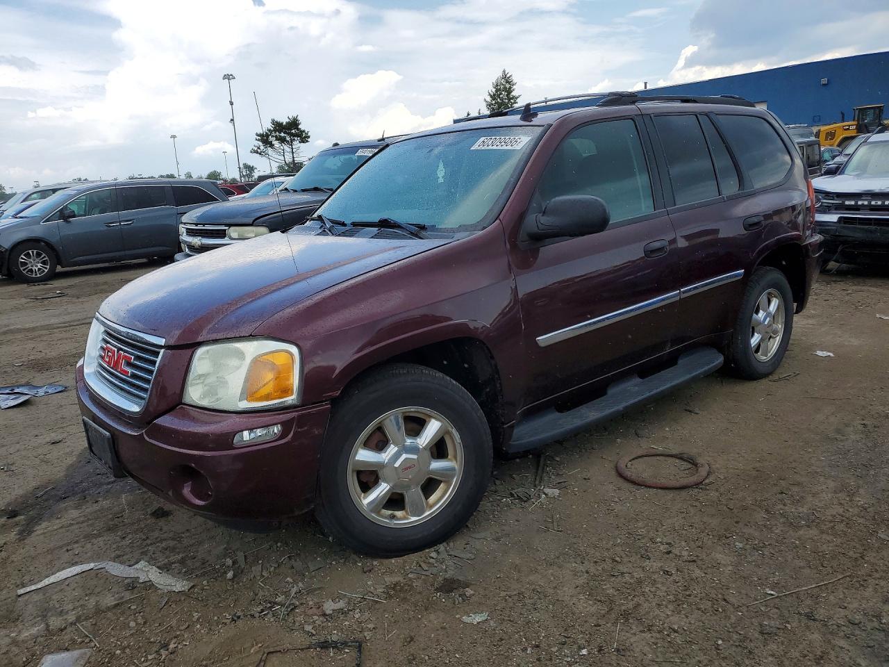 2007 GMC Envoy SLE, VIN 1GKDT13S772240239 — Зад