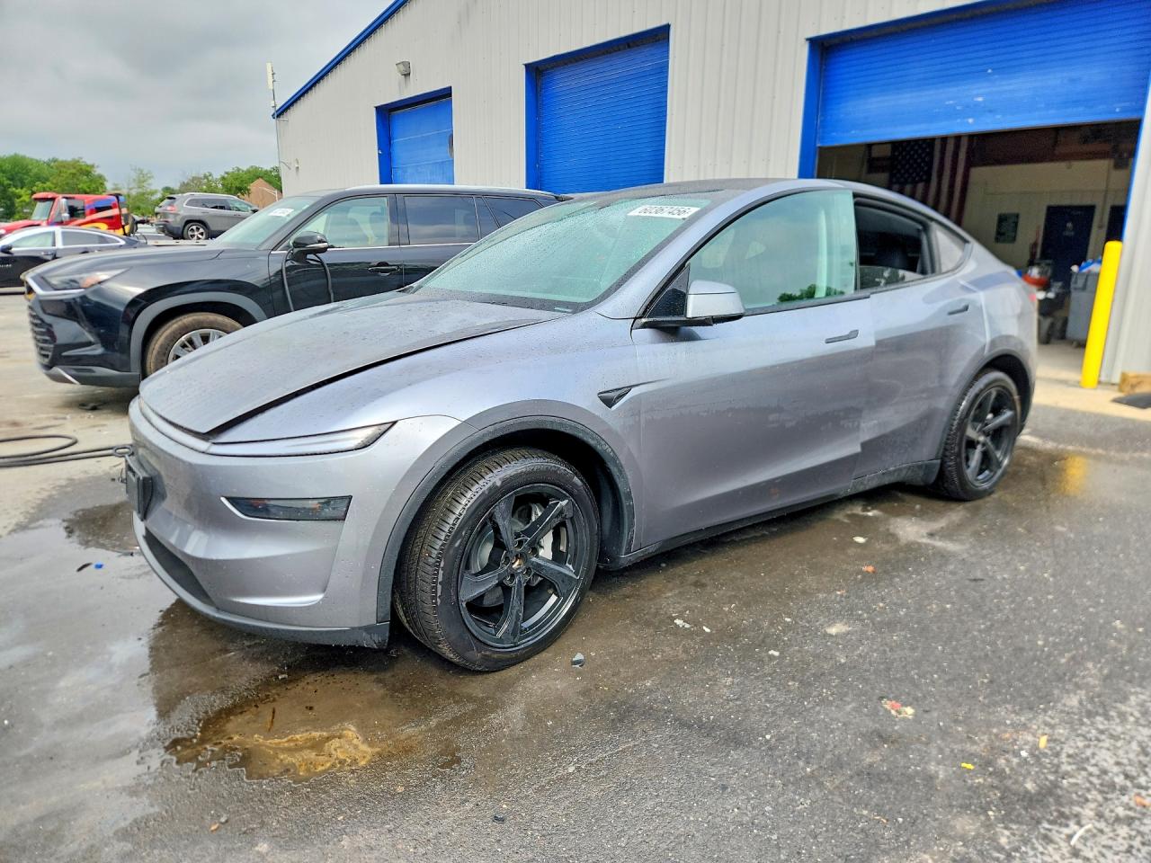 2026 Tesla Model Y Long Range Launch Series, VIN 7SAYGDEE2TA458509 — Water / flood