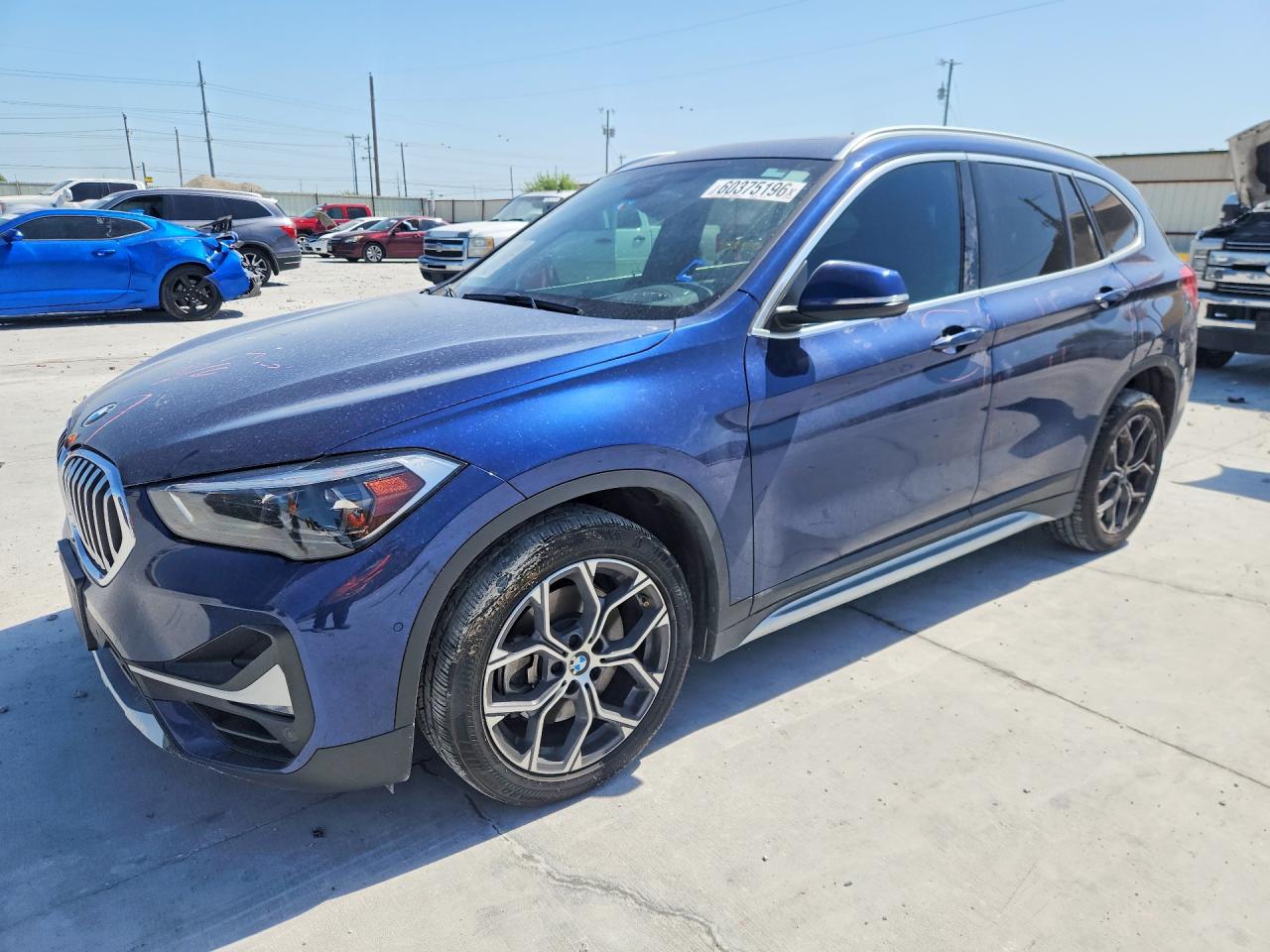2020 BMW X1 sDrive28i, VIN WBXJG7C01L5R91921 — Side