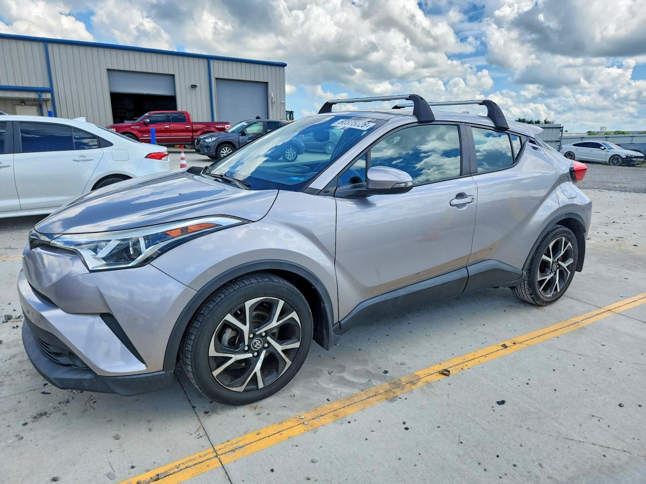 2018 Toyota C-HR XLE, VIN NMTKHMBX3JR028987 — Side