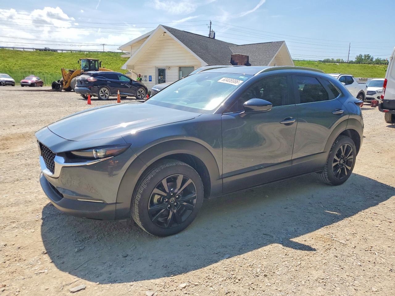 2022 Mazda CX-30 S Carbon Edition, VIN 3MVDMBCL4NM449076 — Hail