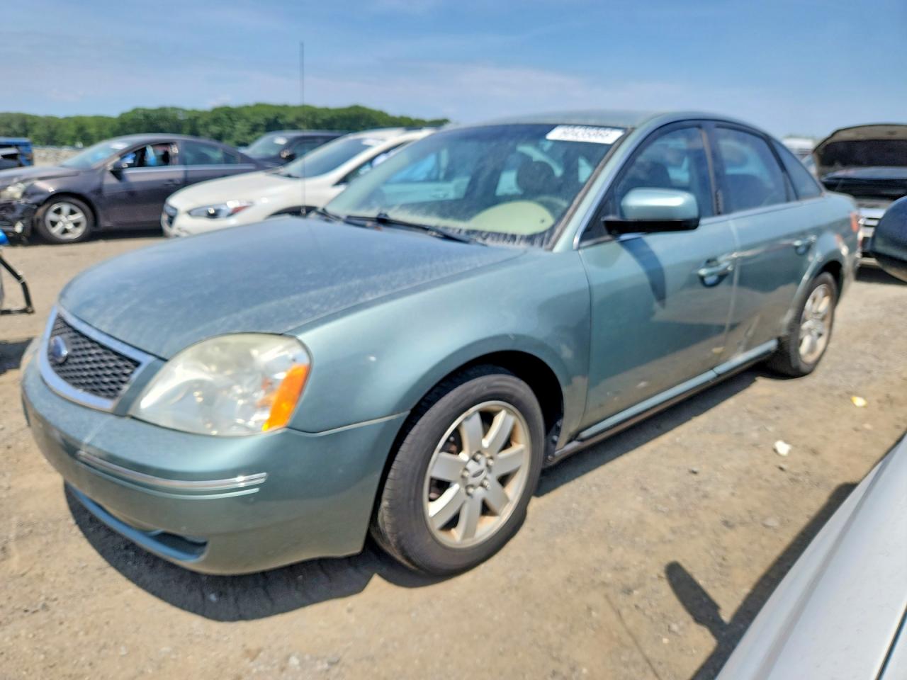 2006 Ford Five Hundred SEL, VIN 1FAHP24106G163024 — Side