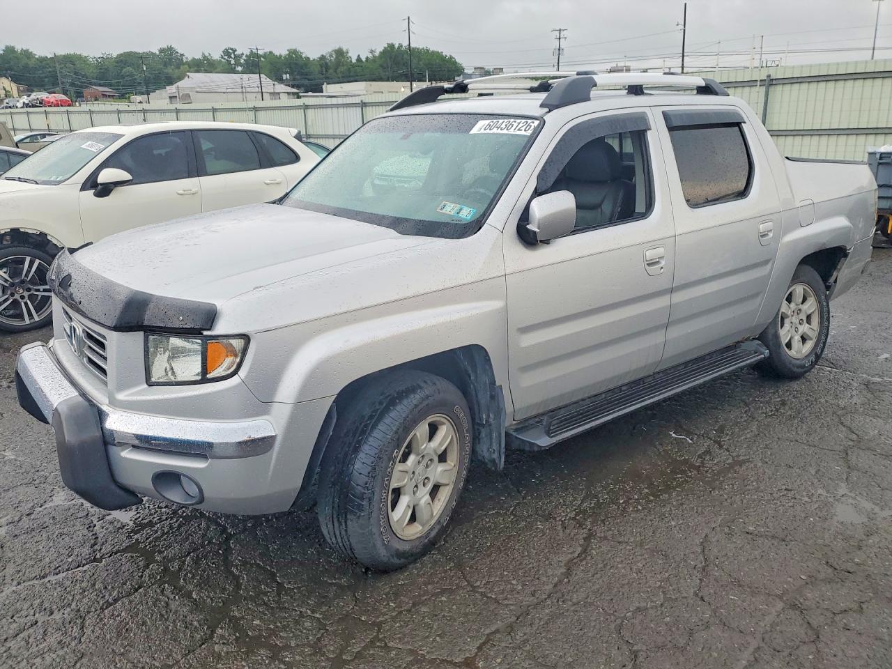 2006 Honda Ridgeline RTL, VIN 2HJYK16596H504892 — Side