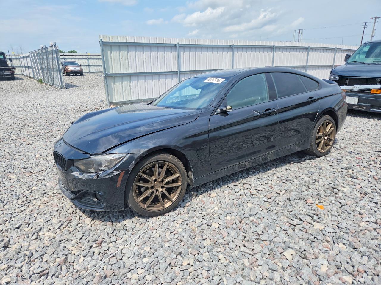 2015 BMW 4 Series 428i xDrive, VIN WBA4A7C52FD415477 — Side