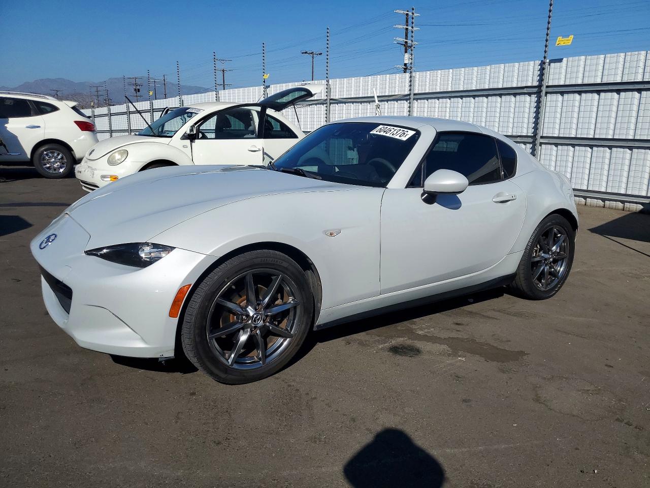2018 Mazda MX-5 Miata Grand Touring, VIN JM1NDAM78J0200259 — Minor dents and scratches