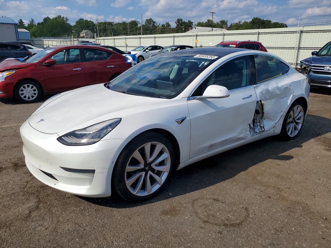 2020 Tesla Model 3 Standard Range Plus, VIN 5YJ3E1EA9LF740710 — Side