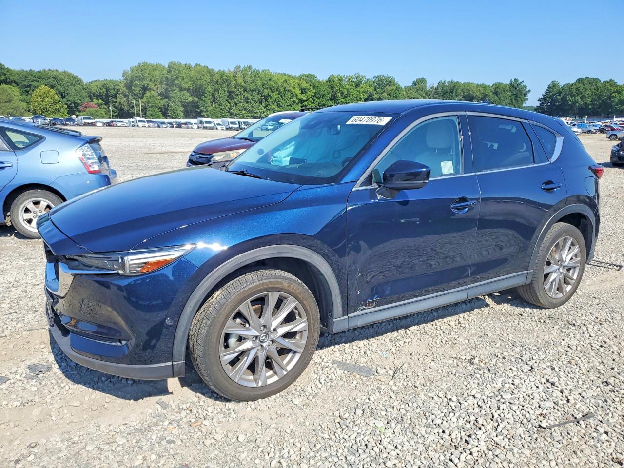 2020 Mazda CX-5 Grand Touring Reserve, VIN JM3KFBAY4L0793693 — Side