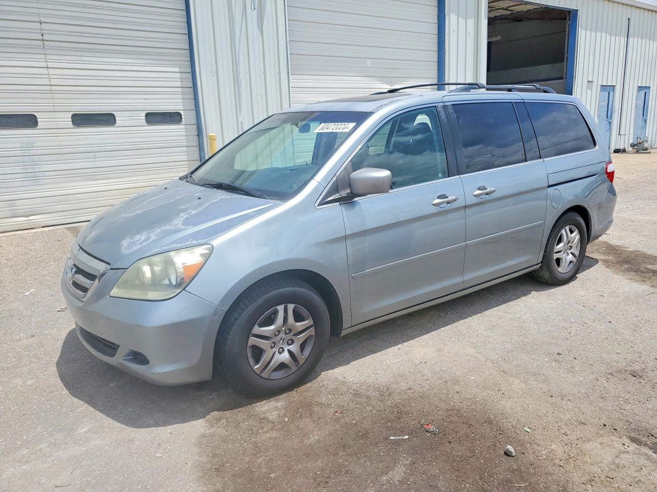 2007 Honda Odyssey EX-L, VIN 5FNRL387X7B096829 — Side