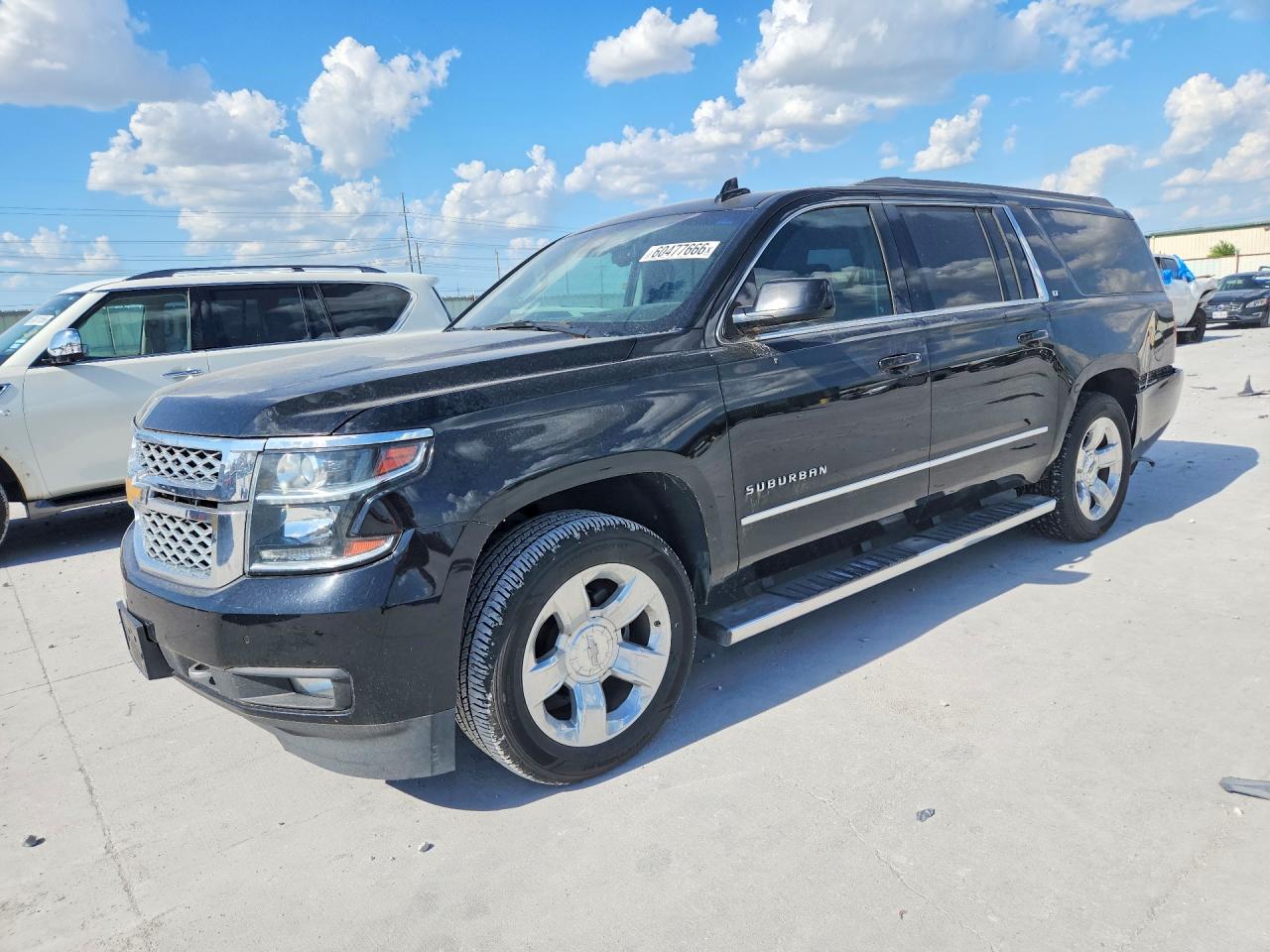 2018 Chevrolet Suburban LT, VIN 1GNSCHKC1JR349744 — Rear end