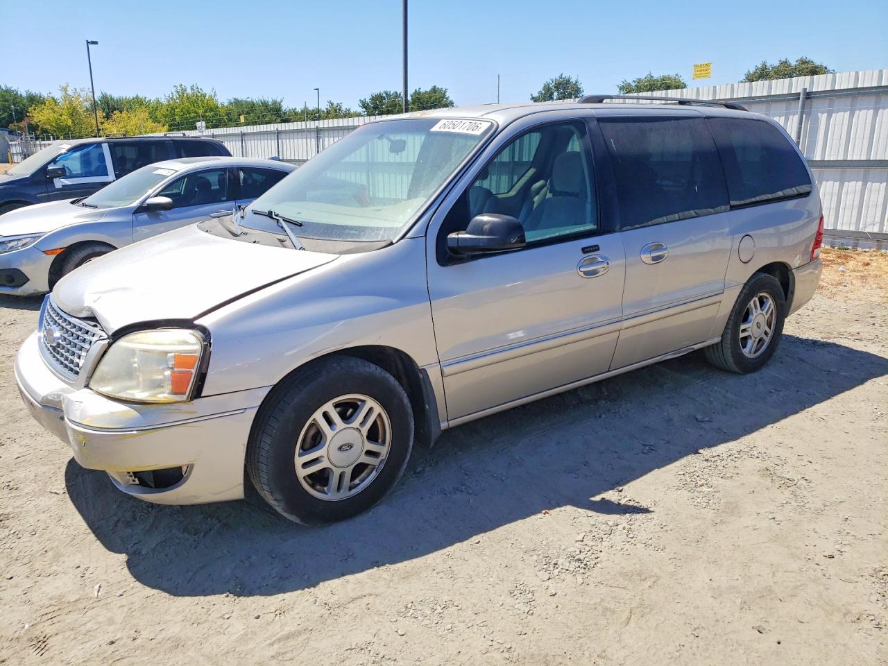 2005 Ford Freestar SEL, VIN 2FMDA52265BA65544 — Side