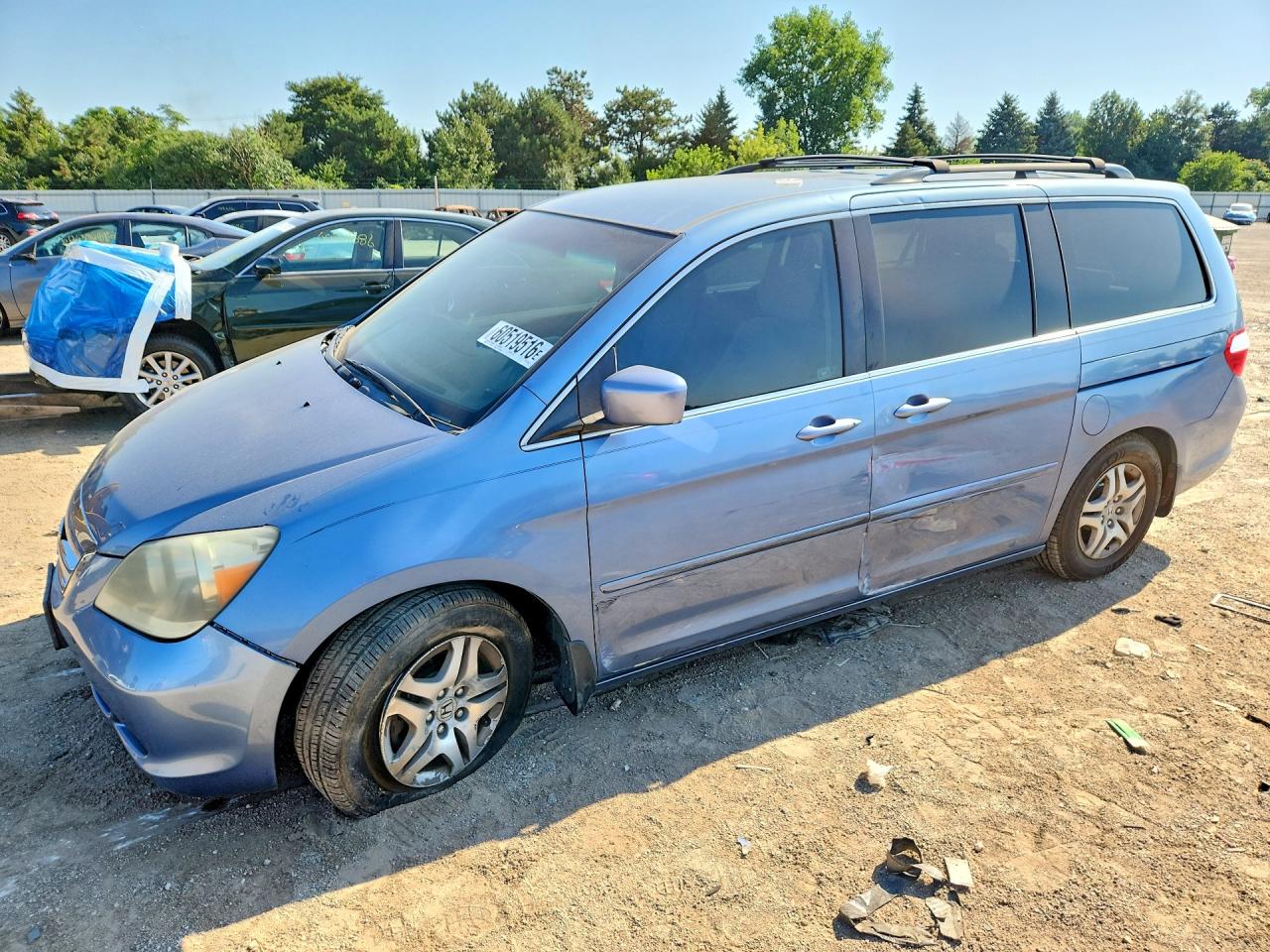 2007 Honda Odyssey EX, VIN 5FNRL38487B031967 — Side