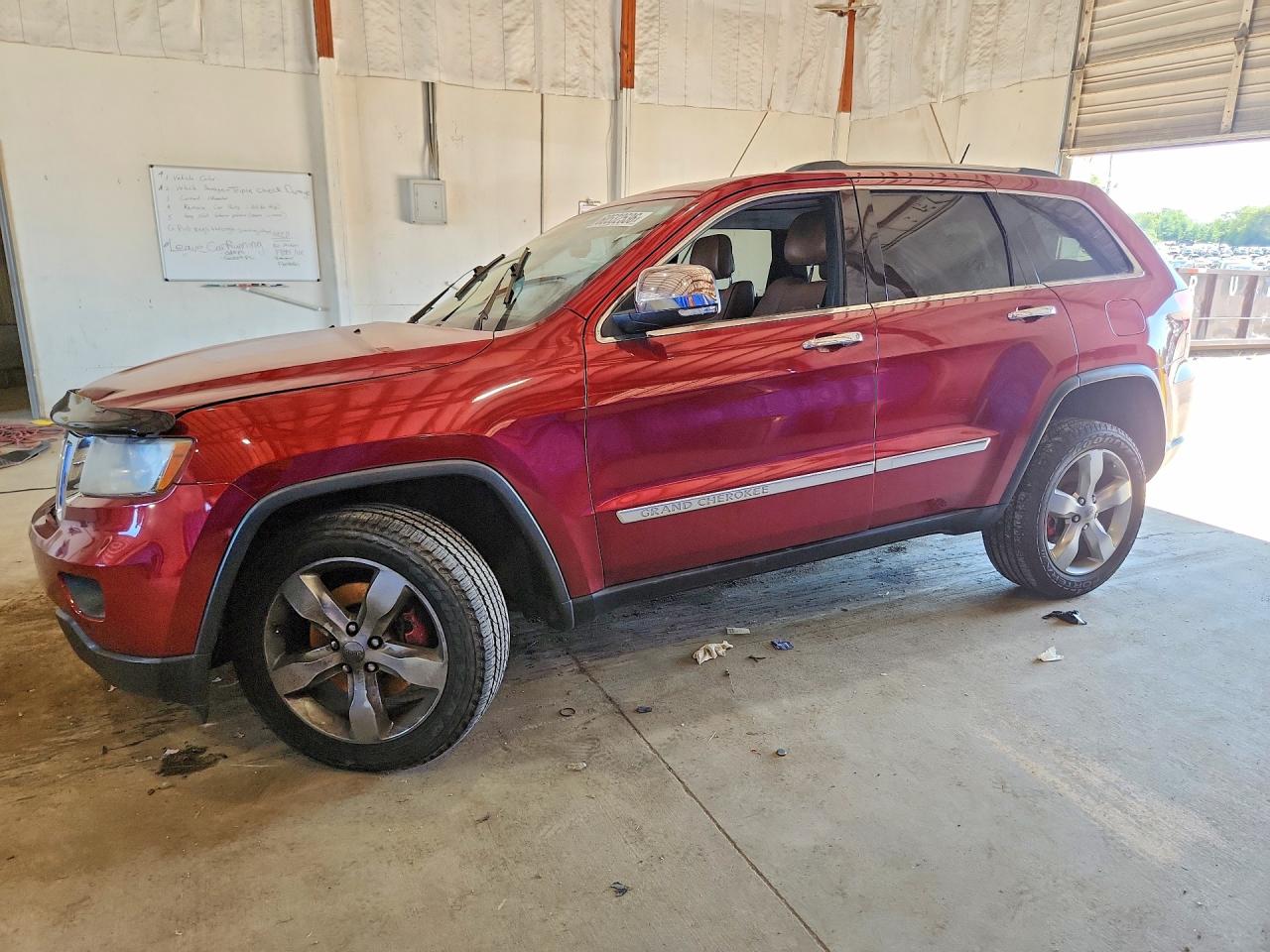 2013 Jeep Grand Cherokee Overland, VIN 1C4RJFCTXDC620498 — Side