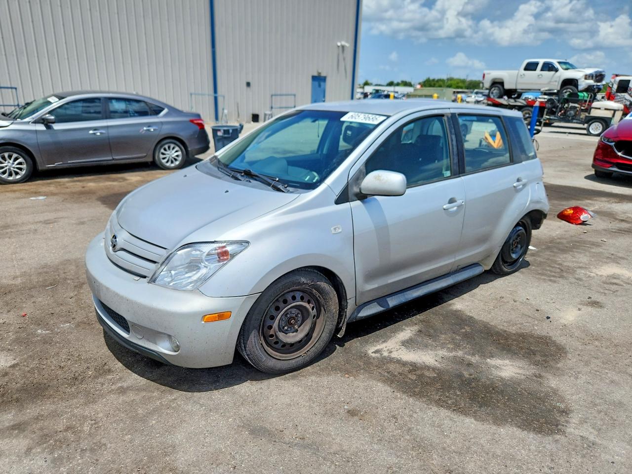 2005 Scion xA, VIN JTKKT604X50080316 — Зад