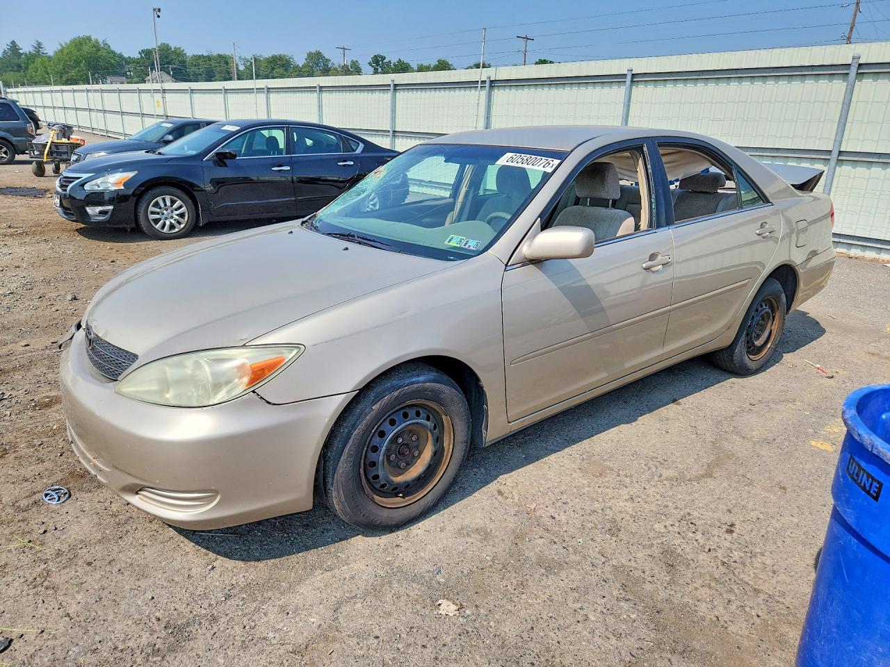 2004 Toyota Camry LE, VIN 4T1BE32K34U940216 — Side