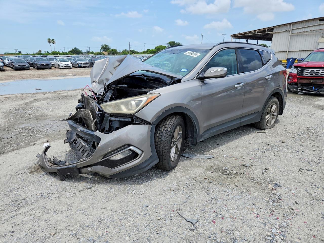 2018 Hyundai Santa Fe 2.4L, VIN 5NMZUDLBXJH074382 — Front end