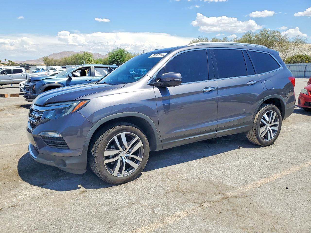 2018 Honda Pilot Touring, VIN 5FNYF6H96JB051772 — Side