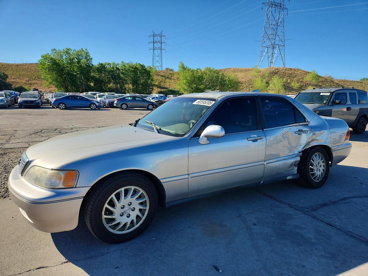 1998 Acura RL, VIN JH4KA9668WC002090 — Side