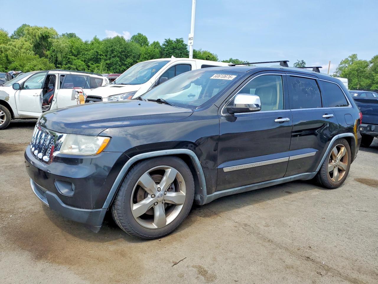 2011 Jeep Grand Cherokee Overland, VIN 1J4RR6GT0BC607690 — Minor dents and scratches
