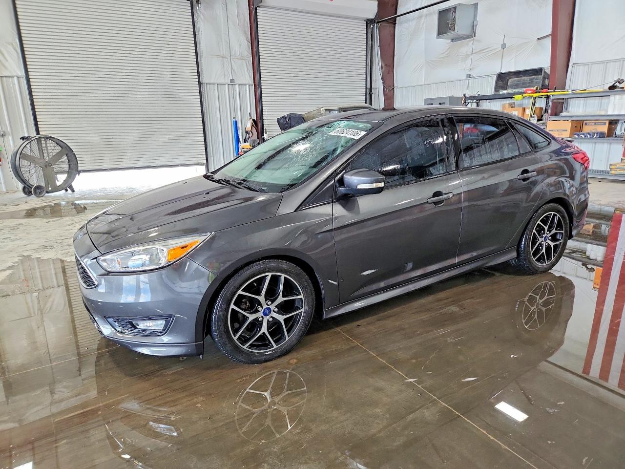 2015 Ford Focus SE, VIN 1FADP3F28FL373047 — Hail