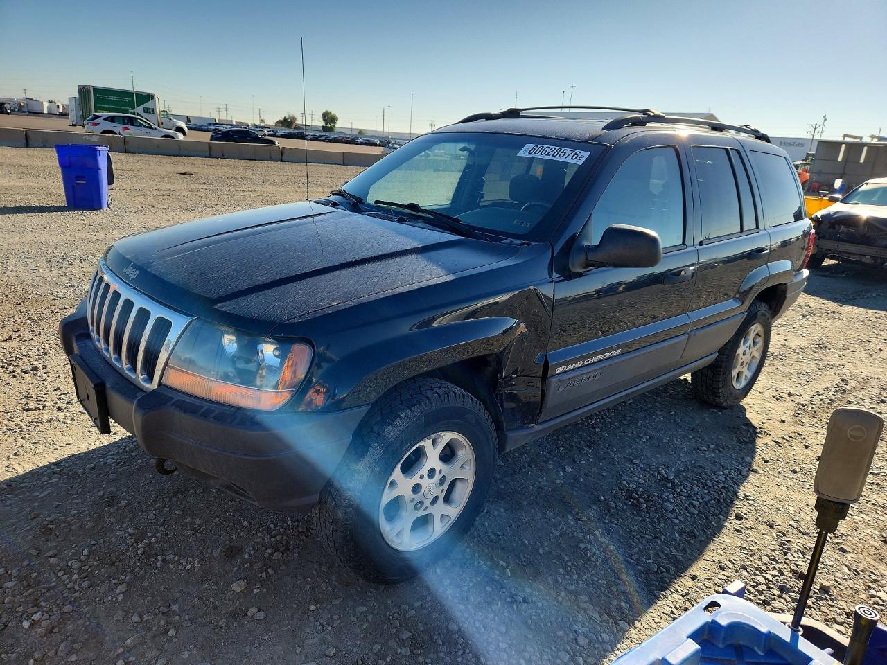 1999 Jeep Grand Cherokee Laredo, VIN 1J4GW58SXXC594549 — Side