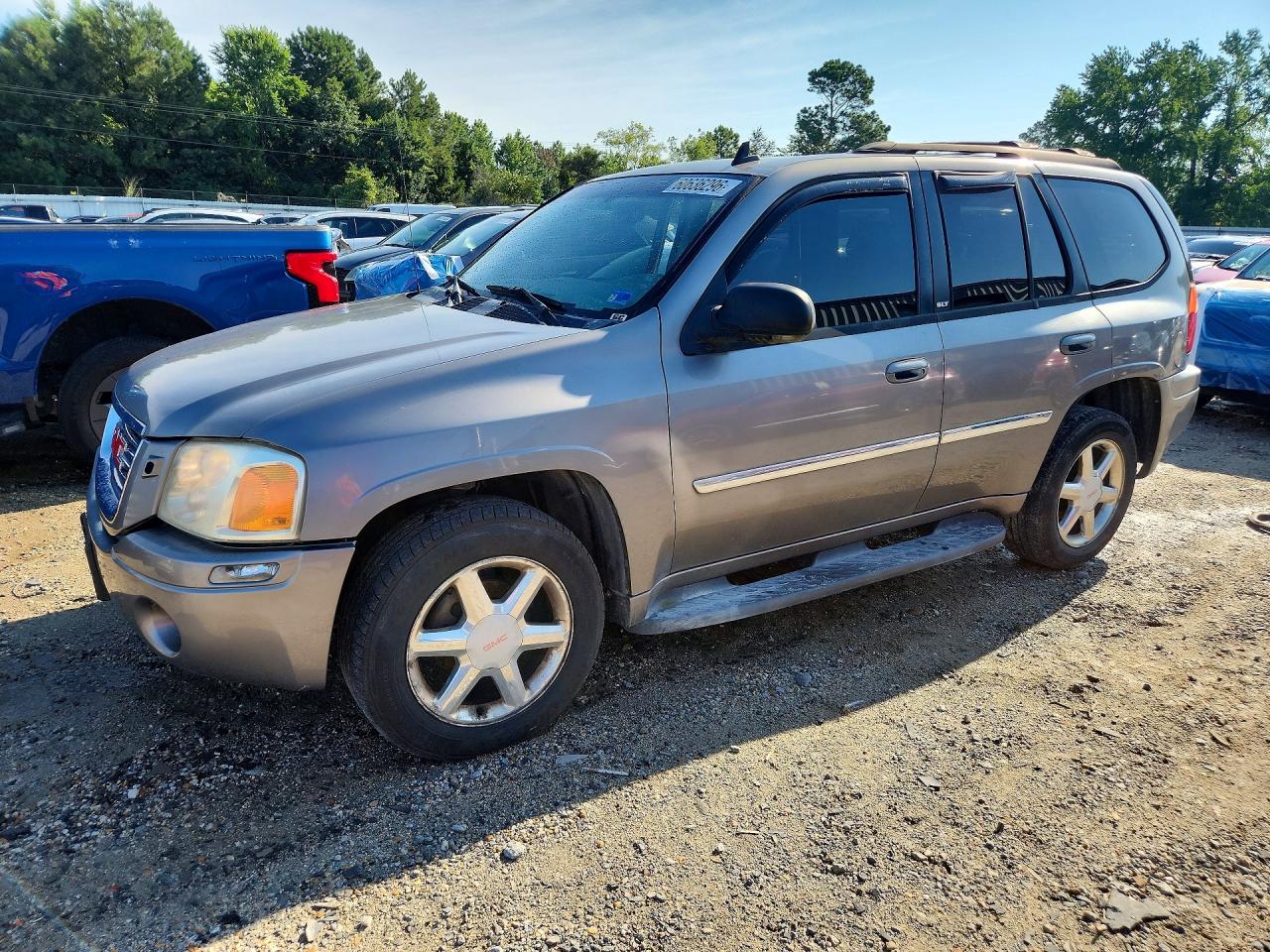 2008 GMC Envoy SLT, VIN 1GKDS13S482208160 — Бок