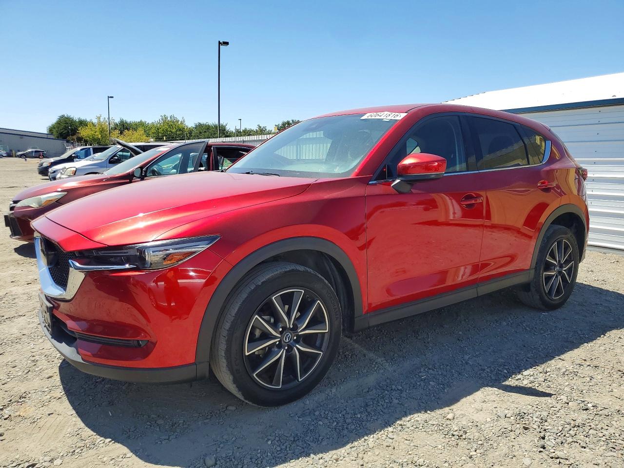 2017 Mazda CX-5 Grand Touring, VIN JM3KFBDL7H0160659 — Бок