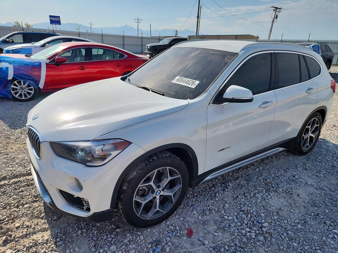 2018 BMW X1 xDrive28i, VIN WBXHT3C31J5F89149 — Minor dents and scratches