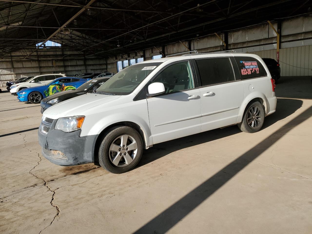2015 Dodge Grand Caravan SXT, VIN 2C4RDGCG6FR585310 — Partial repair