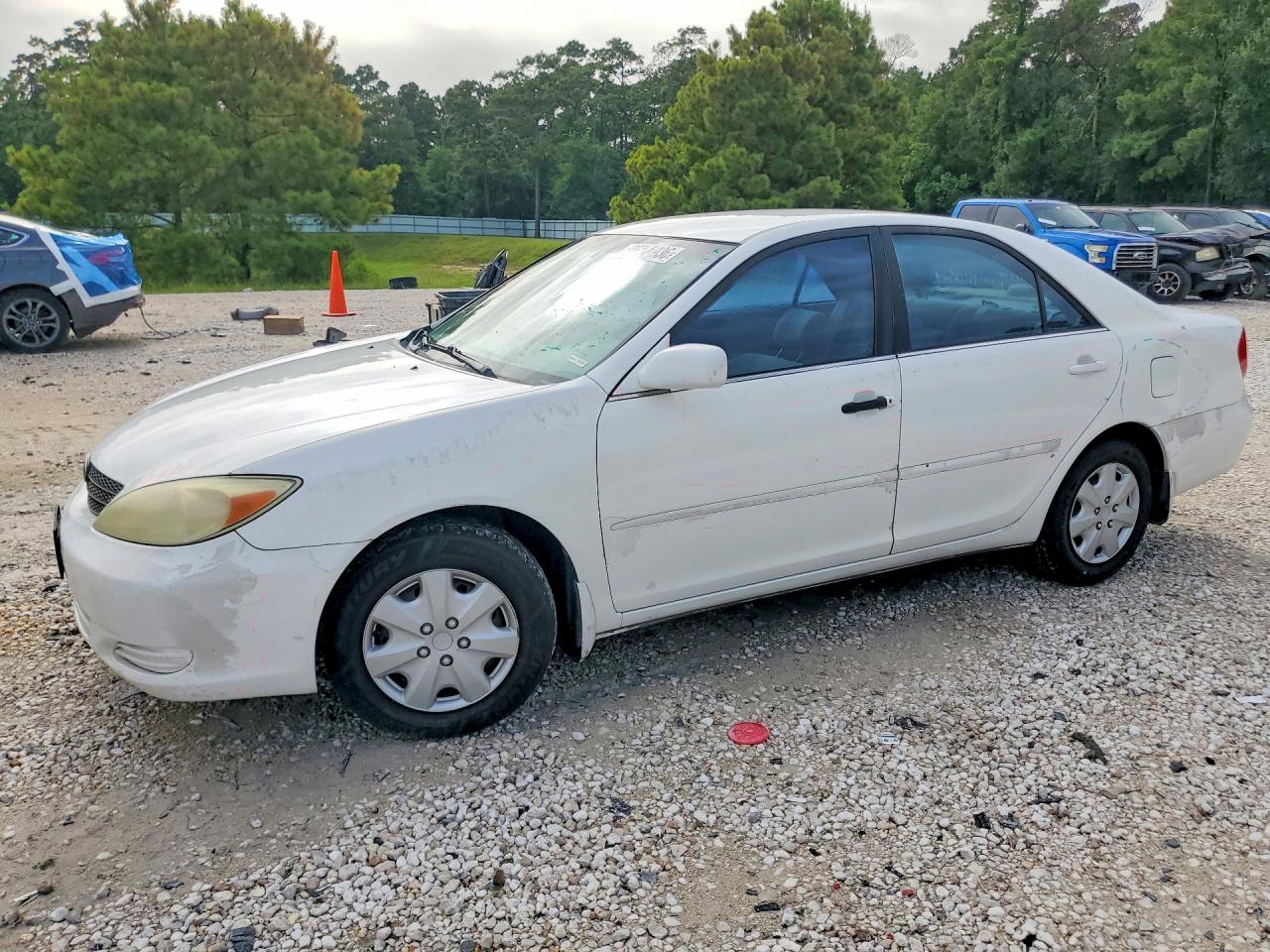 2002 Toyota Camry LE, VIN 4T1BE32K22U084971 — Side