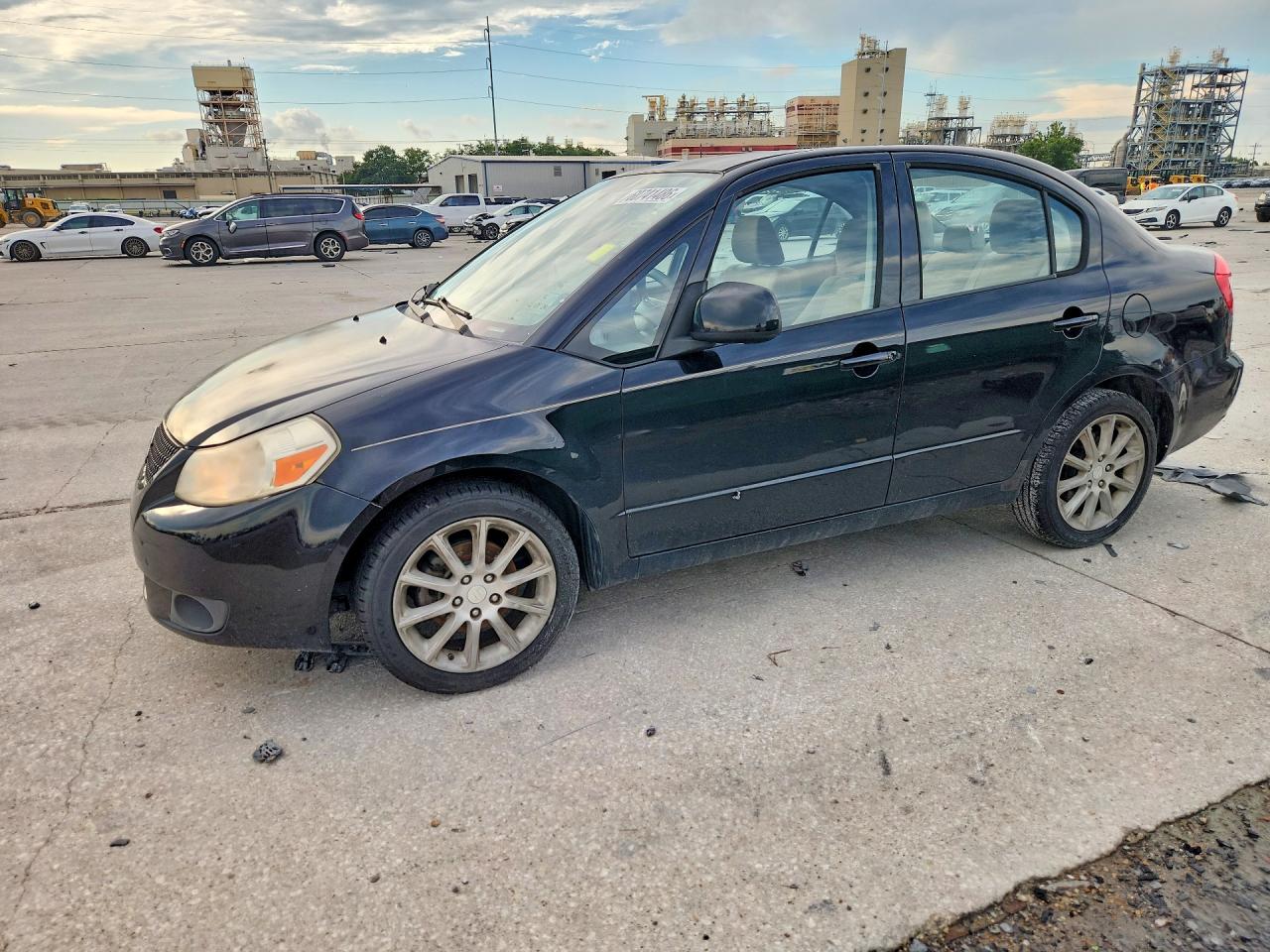 2011 Suzuki SX4 LE, VIN JS2YC5A21B6303012 — Minor dents and scratches