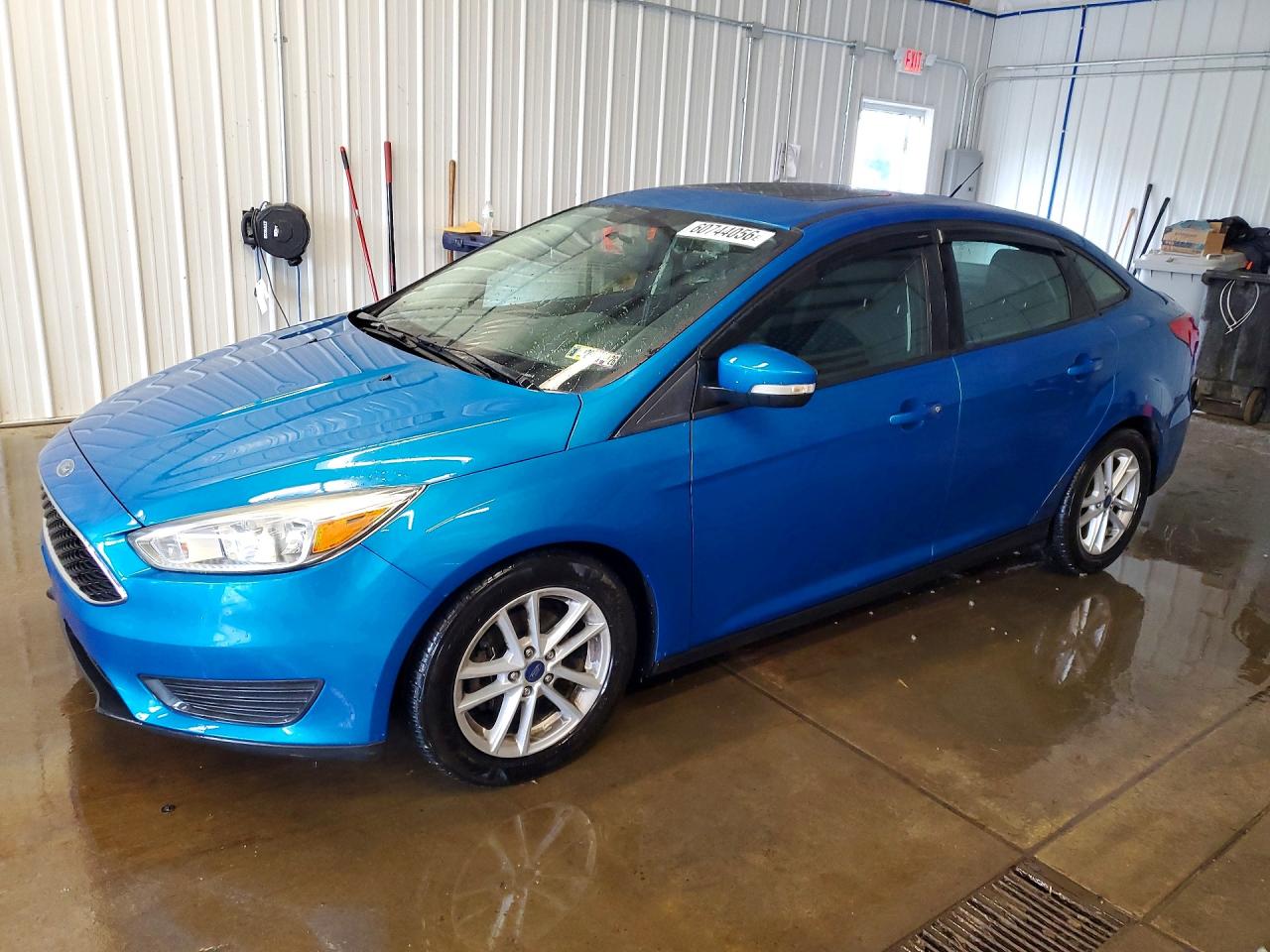 2015 Ford Focus SE, VIN 1FADP3F29FL355463 — Side