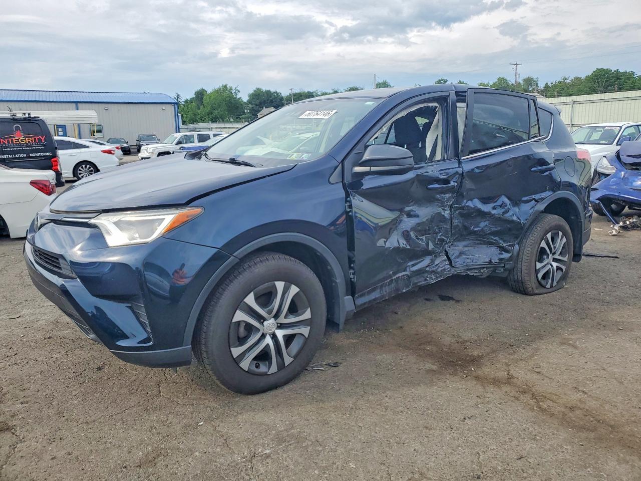 2018 Toyota RAV4 LE, VIN JTMBFREV1JJ217701 — Side