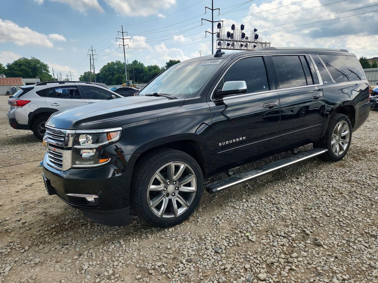 2015 Chevrolet Suburban LTZ, VIN 1GNSKKKC9FR608424 — Мелкие вмятины и царапины