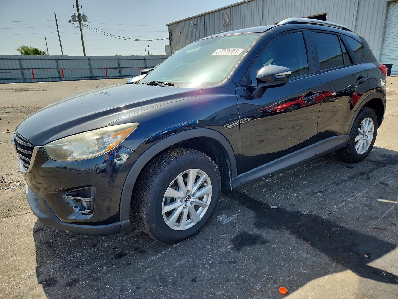 2016 Mazda CX-5 Touring, VIN JM3KE4CY9G0738822 — Град