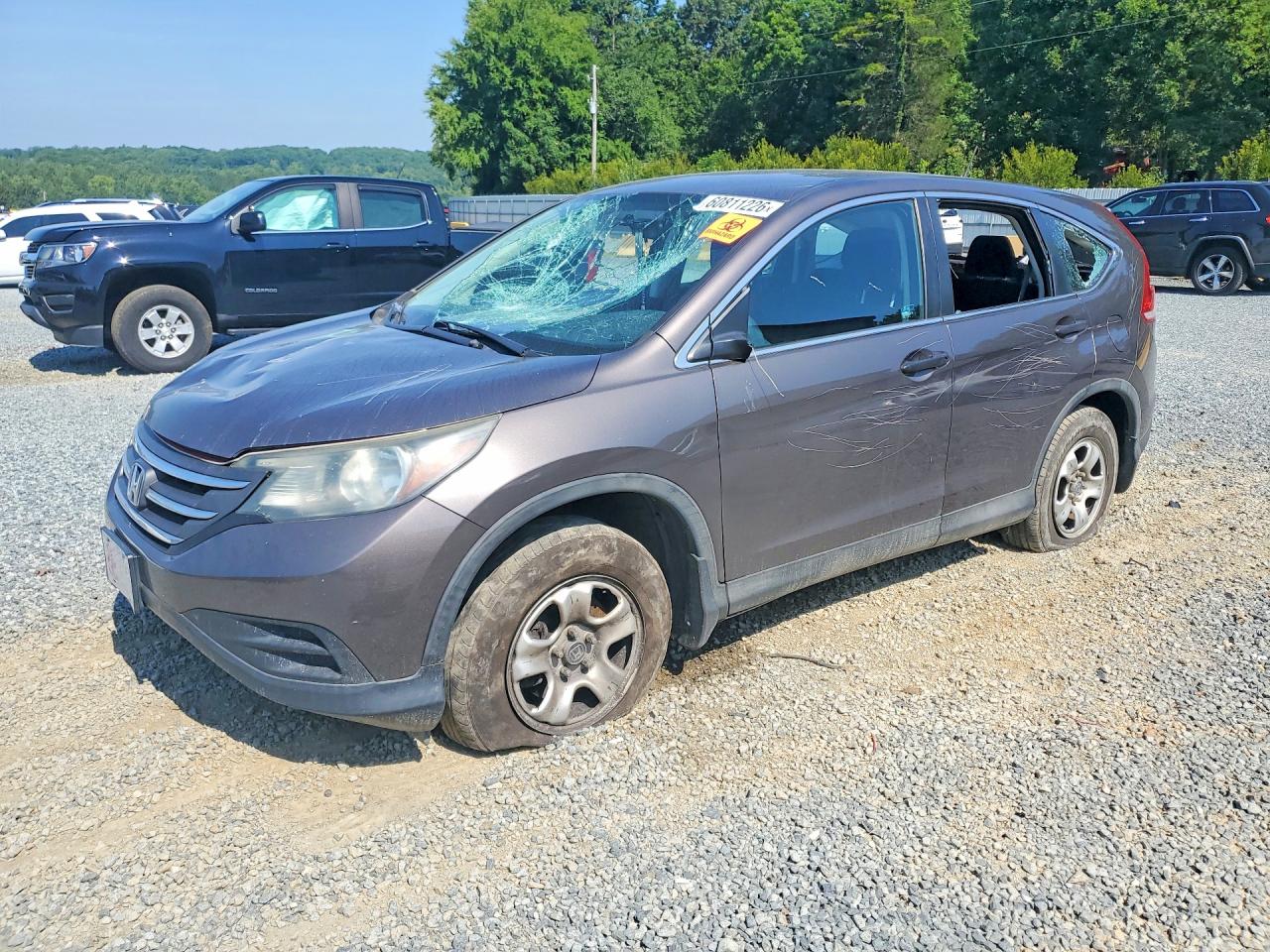 2014 Honda CR-V LX, VIN 2HKRM3H36EH559171 — Vandalism