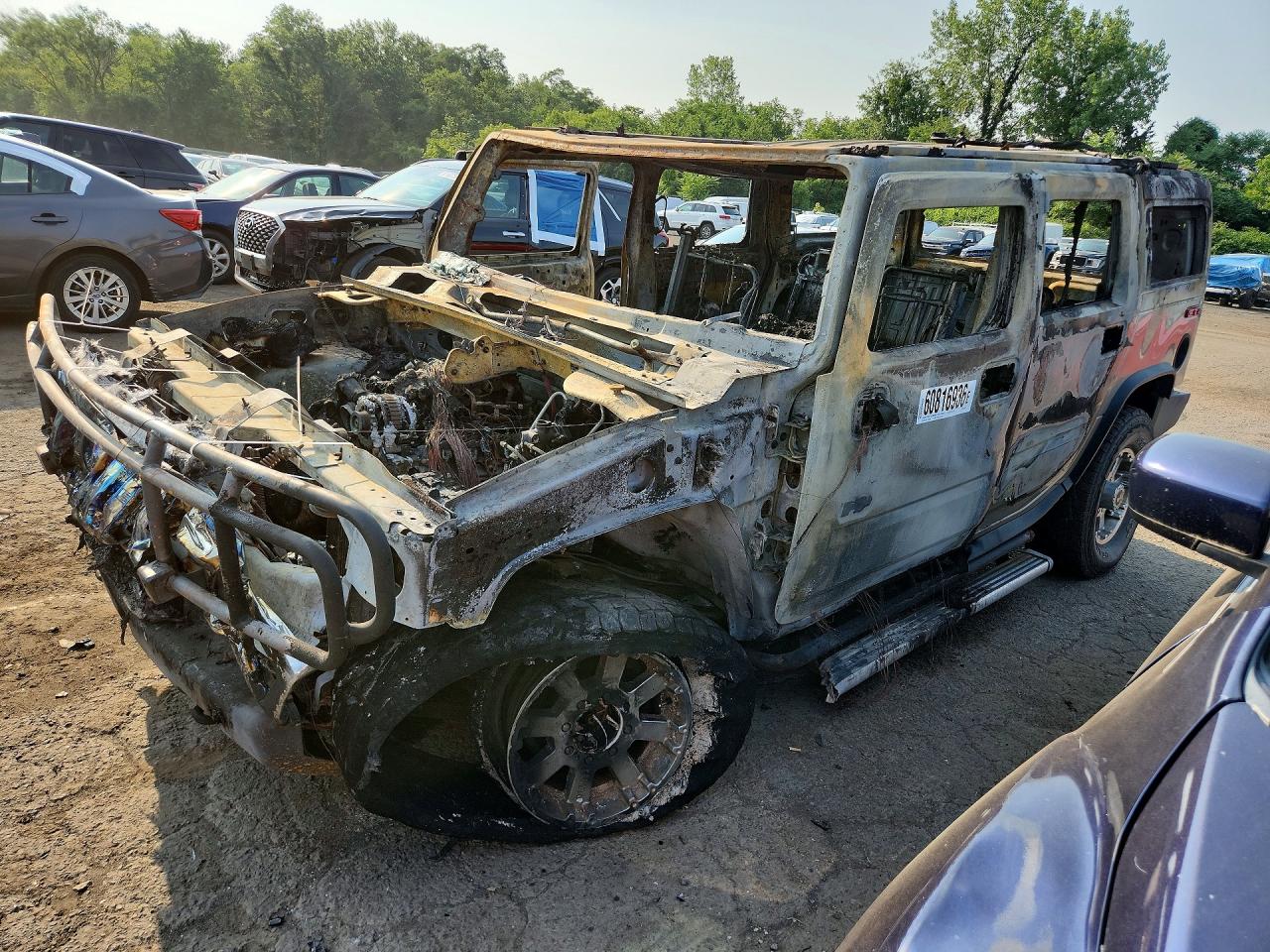 2003 Hummer H2, VIN 5GRGN23U23H126097 — Burn