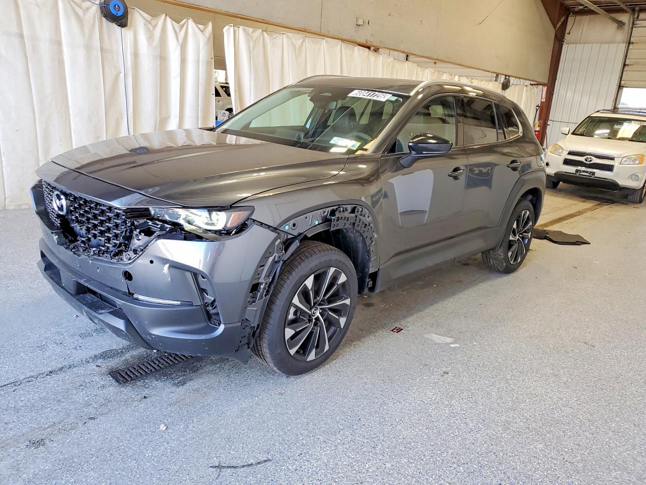 2026 Mazda CX-50 Hybrid Premium Plus, VIN 7MMVAAEW6TN171266 — Front end