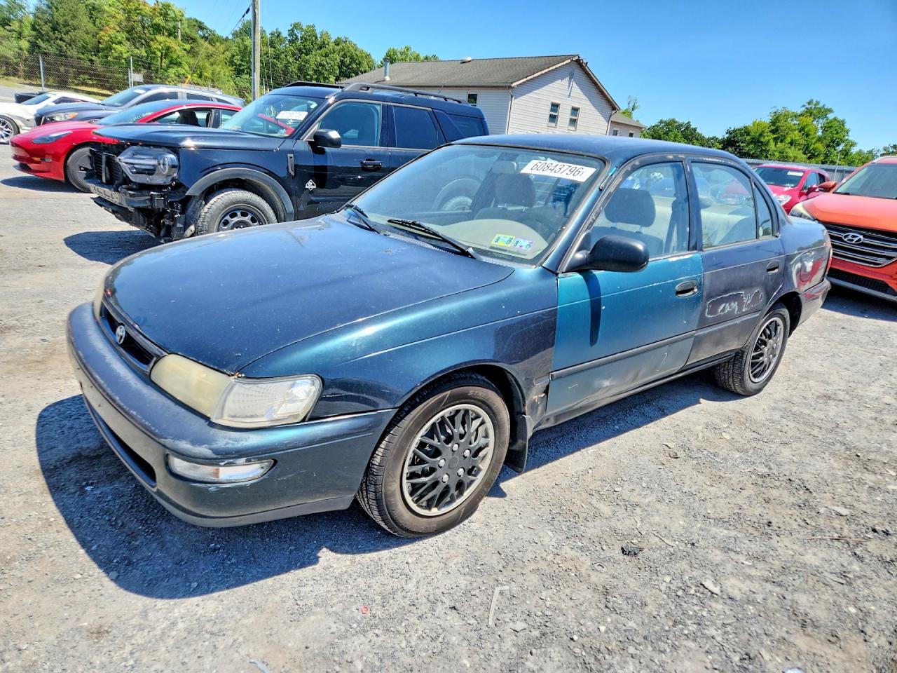 1997 Toyota Corolla CE, VIN 2T1BA02E3VC214783 — Side